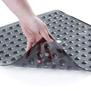 Transparent shower mat detail showing anti-slip suction cups and flexible material.