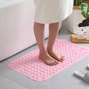 Pink non-slip PVC bath mat with massage suction cups for safe shower and bathroom.