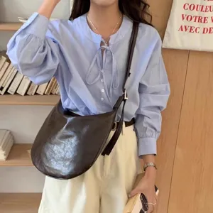 Stylish soft leather crossbody dumpling bag for women, slouchy single shoulder tote.