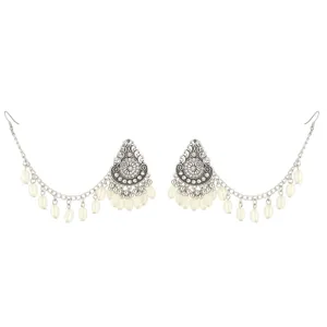 Boho vintage silver ear chain earrings detail shot, intricate carved drop earrings with white beads