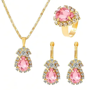 Detailed view of the luxury pink crystal jewelry set featuring sparkling rhinestone halo details.