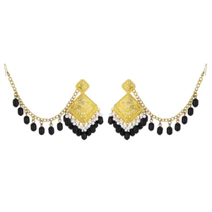 Indian ethnic hollow carved gold earrings with elegant black bead tassel chains detail view