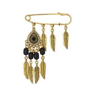 Vintage bohemian gold feather safety pin brooch for women, retro chic jewelry accessory