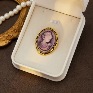 Vintage court style cameo brooch, elegant purple relief lady portrait in gold ornate frame.