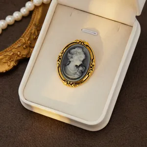 Vintage cameo brooch, elegant gold-plated portrait pin for women's fashion outfits.