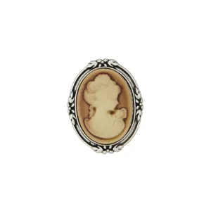 Vintage cameo brooch detail shot, ornate silver tone metal frame with classic profile relief.