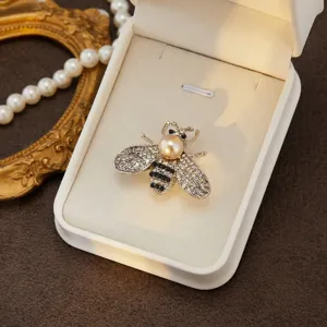 Elegant crystal bee brooch pin with pearl accent for women, charming fashion jewelry gift accessory