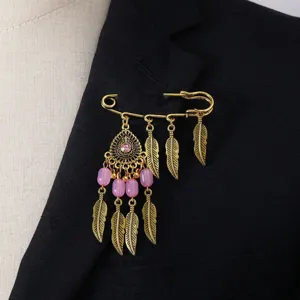 Vintage gold tone feather safety pin brooch boho crystal beaded lapel jewelry detail view