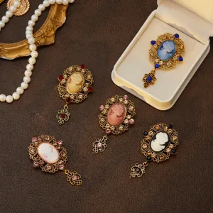 Vintage medieval cameo brooch set with sparkling rhinestones and elegant carved portrait.