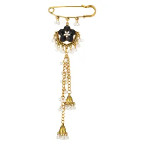 Ethnic gold safety pin brooch with black crystal flowers, pearl chains and jhumka tassel charms.