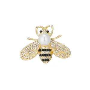 Exquisite gold-tone bee brooch detail, sparkling rhinestones and large white pearl accent.