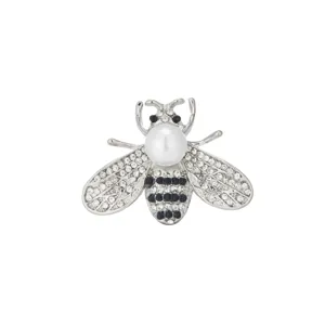 Detailed close-up of a silver-tone bee brooch adorned with sparkling clear rhinestones and a pearl.