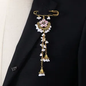 Elegant South-East Asian style gold brooch with pink crystal flower and pearl tassels.