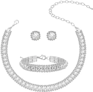 Close-up details of shiny rhinestone jewelry set, crystal necklace, bracelet and earrings.