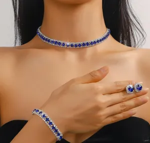 Elegant blue crystal jewelry set including necklace, bracelet and sparkling earrings for women.