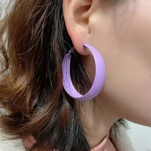 Purple matte hoop earring detail close-up, stylish geometric circle design for women daily use.