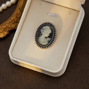 Vintage cameo brooch with lady profile relief, elegant court style accessory in a chic box.