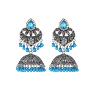 Ethnic silver-tone jhumka earrings with blue teardrop stones and delicate beaded tassels.