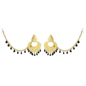 Detailed shot of Indian vintage filigree ear chains with black beads and gold finish.