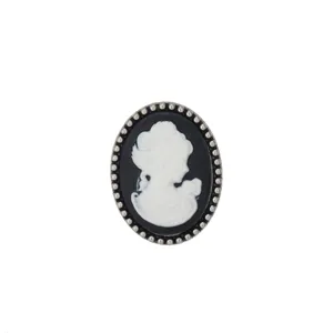 Vintage cameo brooch featuring an elegant black and white lady profile silhouette in silver tone.