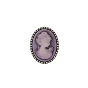 Close-up of vintage purple lady cameo brooch with silver beaded edge detailing and classic design.