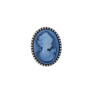 Close-up detail of vintage blue cameo brooch with classic carved profile and silver beaded frame.