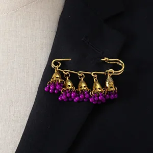 Retro bohemian style bell tassel brooch featuring golden safety pin and purple bead charms.