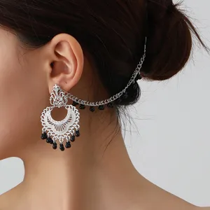 Ethnic style filigree ear chain with black bead tassels, vintage metal ear cuff for women.