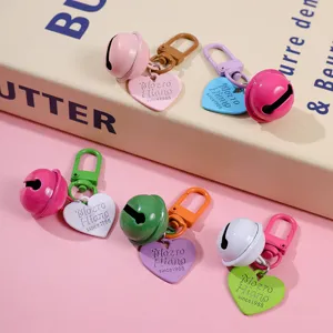 Cute colorful metal bell keychain with heart pendant, stylish painted bag charm and accessory.