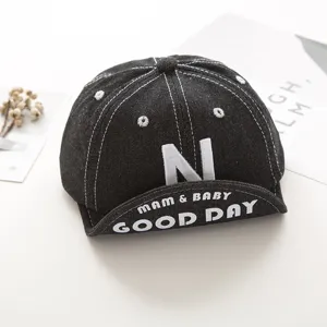 Infant dark denim baseball cap with white embroidered N letter and English text details.