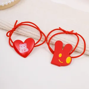 Red acrylic hair ties set with cute cartoon heart and rabbit pendants for daily styling.
