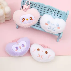 Cute plush heart keychain and bag charm with sweet embroidered expressions and crown decor.