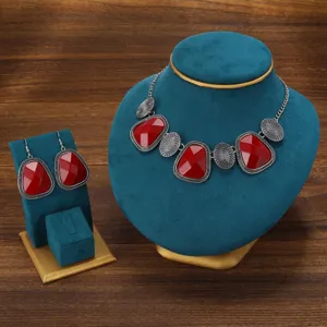 Vintage red stone necklace earrings set detail, ethnic style silver jewelry showcase.