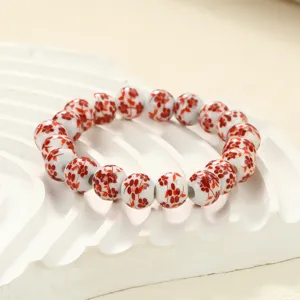 Elegant red floral ceramic beaded bracelet for women, traditional style handmade jewelry.