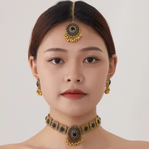 Vintage Indian ethnic choker necklace earrings and headpiece set with black stones and tassels.