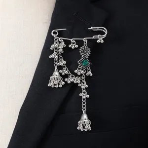 Close-up detail view of the vintage silver-tone bohemian tassel brooch pin accessory.