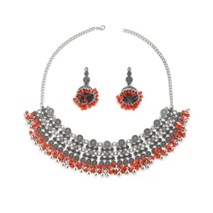 Bohemian silver tone choker necklace and jhumka earrings set with red beads details.