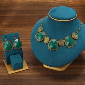 Retro green stone necklace earrings set detail close-up showcasing antique bronze geometric design.