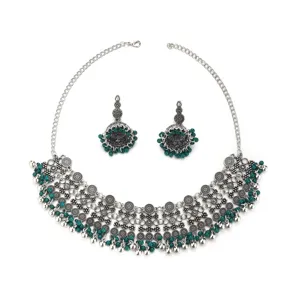 Bohemian ethnic silver alloy necklace and matching jhumka earrings set with green beads.