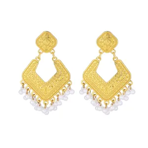 Vintage gold tone ornate drop earrings with delicate white pearl fringe details for women.
