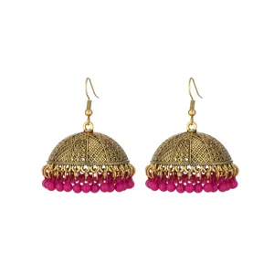 Vintage gold-toned Indian Jhumka earrings featuring elegant pink beaded fringe details.