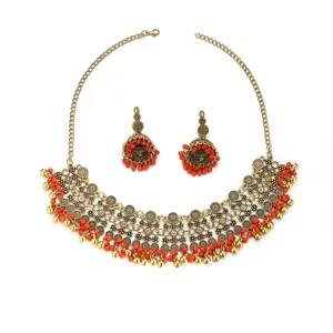 Ethnic boho gold-tone choker necklace and matching jhumka earrings set with red beads.