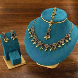 Bohemian vintage gold tone jewelry set with necklace earrings and maang tikka for women.