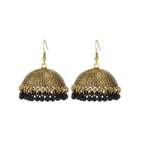 Detailed close-up of vintage ethnic jhumka dangle earrings with black bead fringes.