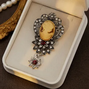 Exquisite vintage cameo rhinestone brooch detail view, classic antique silver alloy fashion jewelry.