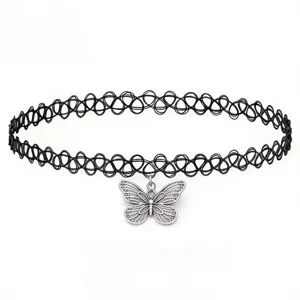 Close-up detail of stylish black stretch tattoo choker necklace with a silver butterfly pendant.