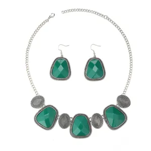 Retro ethnic style green stone necklace and earrings set, perfect jewelry detail showcase.