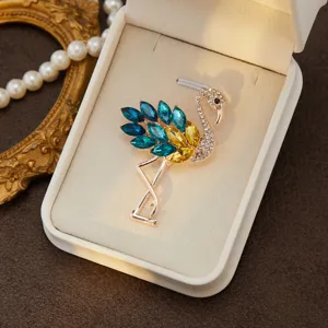 Elegant crystal flamingo brooch, rhinestone embellished lapel pin, chic fashion jewelry accessory.