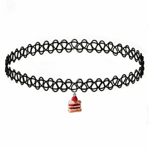 Black stretch tattoo choker necklace with cute strawberry cake pendant, trendy fashion jewelry item.