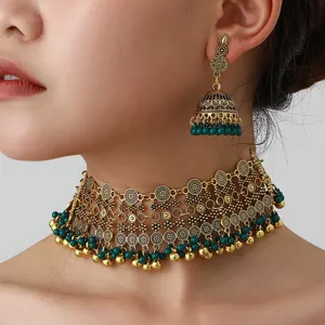 Bohemian ethnic gold alloy bell choker necklace and matching jhumka earrings set detail.